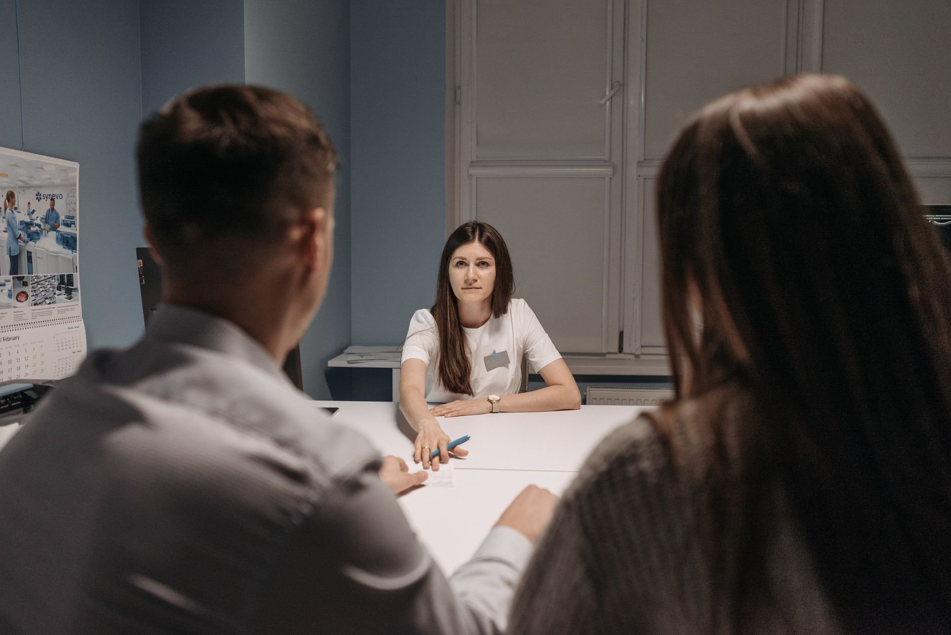Professional healthcare consultation in a warm, well-lit clinical setting